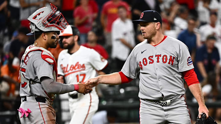 Aug 26, 2025; Baltimore, Maryland, USA; Boston Red Sox pitcher Justin Wilson (right) and catcher Carlos Narvaez (left) celebrate the win against the Baltimore Orioles at Oriole Park at Camden Yards. Mandatory Credit: James A. Pittman-Imagn Images