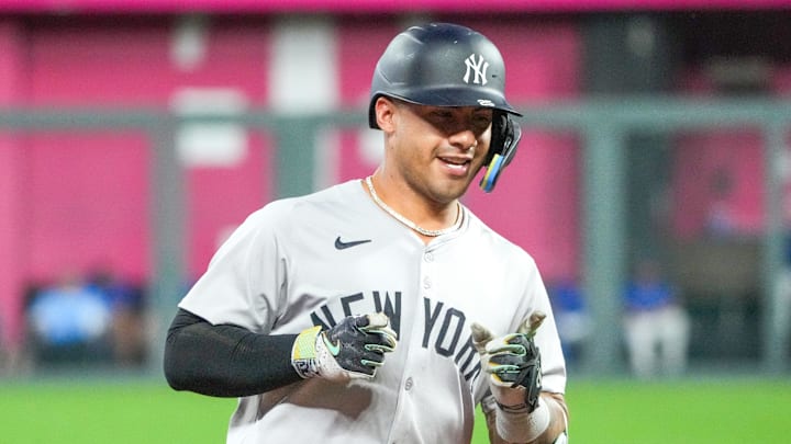 Jun 12, 2024; Kansas City, Missouri, USA; New York Yankees second baseman Gleyber Torres (25) celebrates while running the bases after hitting a three run home run against the Kansas City Royals in the seventh inning at Kauffman Stadium. Mandatory Credit: Denny Medley-USA TODAY Sports