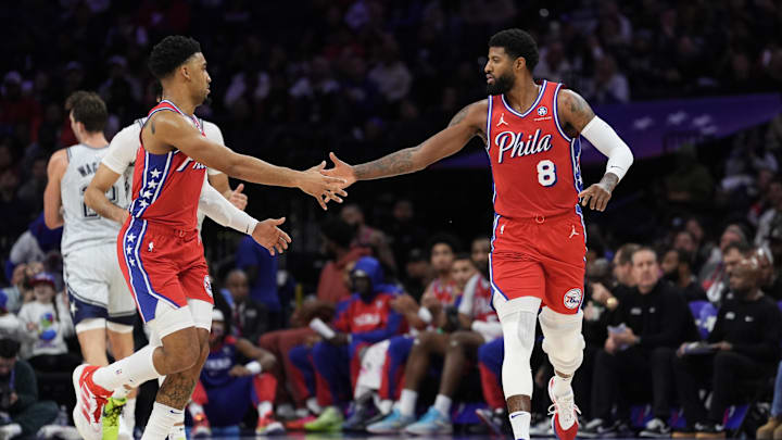 Dec 6, 2024; Philadelphia, Pennsylvania, USA; Philadelphia 76ers forward Paul George (8) reacts with forward KJ Martin (1) against the Orlando Magic in the second quarter at Wells Fargo Center. Mandatory Credit: Kyle Ross-Imagn Images