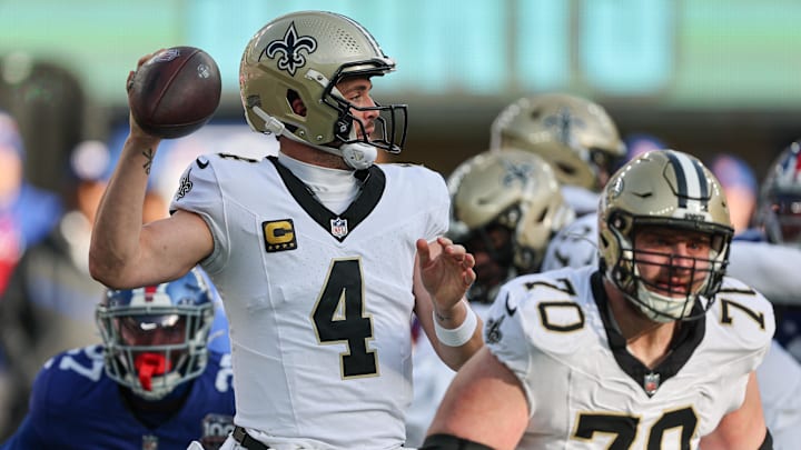 Dec 8, 2024; East Rutherford, New Jersey, USA; New Orleans Saints quarterback Derek Carr (4) throws the ball during the first half against the New York Giants at MetLife Stadium. Mandatory Credit: Vincent Carchietta-Imagn Images