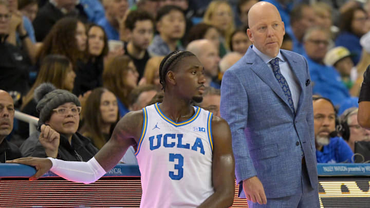Dec 6, 2025; Los Angeles, California, USA;  UCLA Bruins head coach Mick Cronin talks with guard Eric Dailey Jr. (3) during the first half against the Oregon Ducks at Pauley Pavilion presented by Wescom Financial. Mandatory Credit: Jayne Kamin-Oncea-Imagn Images