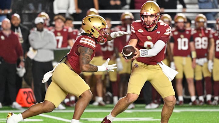 Oct 11, 2025; Chestnut Hill, Massachusetts, USA; Boston College Eagles quarterback Dylan Lonergan (9) hands the ball off to running back Turbo Richard (2) during the first half against the Clemson Tigers at Alumni Stadium. Mandatory Credit: Eric Canha-Imagn Images