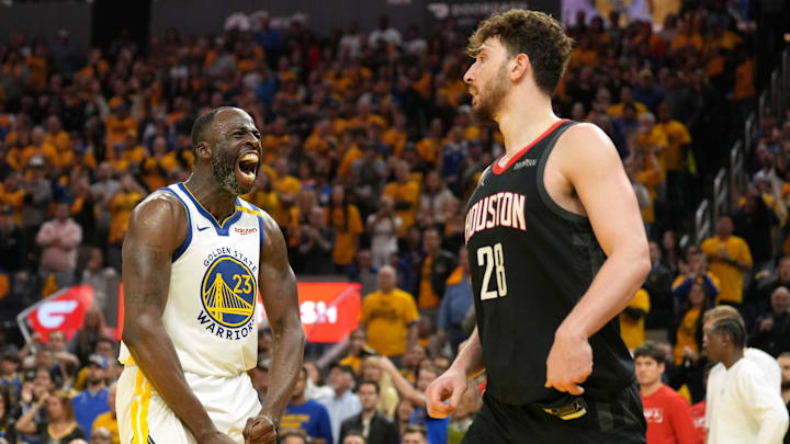 Apr 26, 2025; San Francisco, California, USA; Golden State Warriors forward Draymond Green (23) reacts after forcing a turnover by Houston Rockets center Alperen Sengun (28) during the fourth quarter of game three of first round for the 2024 NBA Playoffs at Chase Center. Mandatory Credit: Darren Yamashita-Imagn Images