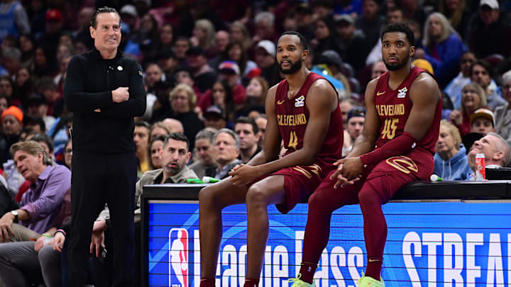 Apr 2, 2025; Cleveland, Ohio, USA;  Cleveland Cavaliers forward Evan Mobley (4) and guard Donovan Mitchell (45) wait along side head coach Kenny Atkinson to enter the game during the first half against the New York Knicks at Rocket Arena. Mandatory Credit: Ken Blaze-Imagn Images