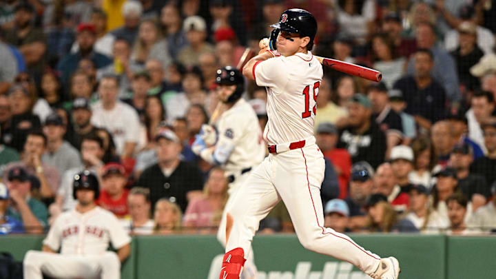 Jul 9, 2025; Boston, Massachusetts, USA; Boston Red Sox outfielder Roman Anthony (19) hits a single against the Colorado Rockies during the fifth inning at Fenway Park. Mandatory Credit: Brian Fluharty-Imagn Images