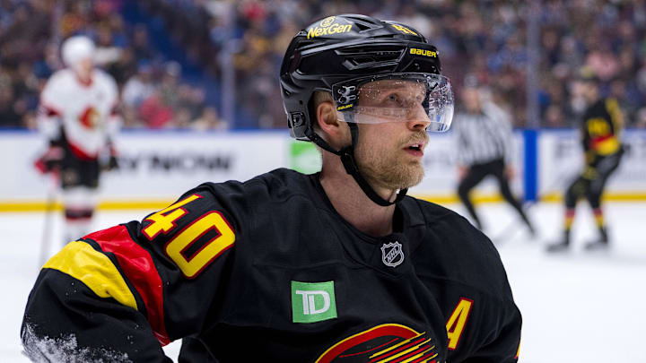 Dec 21, 2024; Vancouver, British Columbia, CAN; Vancouver Canucks forward Elias Pettersson (40) reacts after getting checked against the Ottawa Senators during the second period at Rogers Arena. Mandatory Credit: Bob Frid-Imagn Images