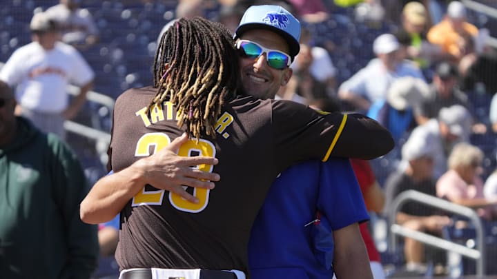 Mar 4, 2024; Peoria, Arizona, USA; San Diego Padres right fielder Fernando Tatis Jr. (23) and Chicago Cubs coach Ryan Flaherty meet before a game at Peoria Sports Complex. Mandatory Credit: Rick Scuteri-Imagn Images Mar 4, 2024; Peoria, Arizona, USA; San Diego Padres right fielder Fernando Tatis Jr. (23) and Chicago Cubs coach Ryan Flaherty meet before a game at Peoria Sports Complex. Mandatory Credit: Rick Scuteri-Imagn Images