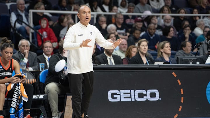 Mar 29, 2024; Albany, NY, USA; Oregon State Beavers head coach Scott Rueck speaks to his players on the court during the first half in the semifinals of the Albany Regional of the 2024 NCAA Tournament at the MVP Arena at MVP Arena. Mandatory Credit: Gregory Fisher-Imagn Images