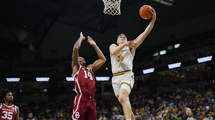 Missouri Tigers forward Caleb Grill (31) drives to the hoop, in a game against the Alabama Crimson Tide this season.