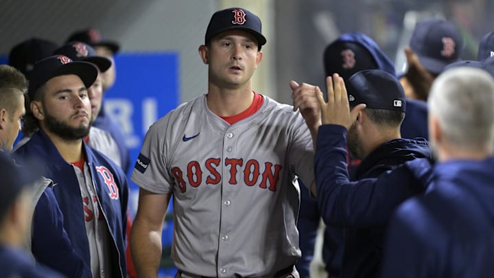 Apr 6, 2024; Anaheim, California, USA; Boston Red Sox pitcher Garrett Whitlock (22) gets high fives in the dugout after he was taken out of the game in the fifth inning against the Los Angeles Angels at Angel Stadium. Mandatory Credit: Jayne Kamin-Oncea-Imagn Images Apr 6, 2024; Anaheim, California, USA; Boston Red Sox pitcher Garrett Whitlock (22) gets high fives in the dugout after he was taken out of the game in the fifth inning against the Los Angeles Angels at Angel Stadium. Mandatory Credit: Jayne Kamin-Oncea-Imagn Images