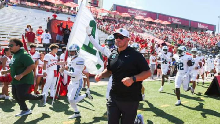 Tulane head coach Jon Sumrall leads the team into the stadium for their game against Louisiana Ragin' Cajuns at Cajun Field on Saturday, September 21st, 2024.