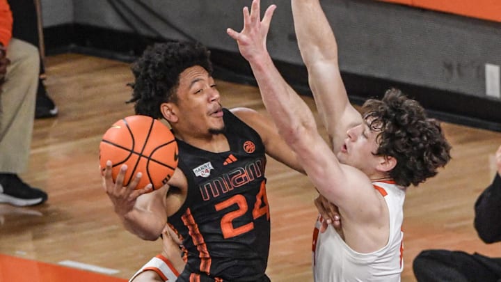 Feb 14, 2024; Clemson, South Carolina, USA;  Miami guard Nijel Pack (24) shoots the ball near Clemson junior forward PJ Hall (24) during the first half at Littlejohn Coliseum Wednesday, February 14, 2024. 