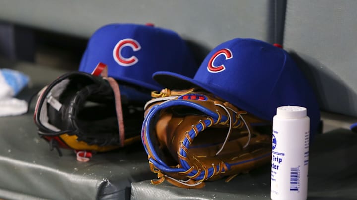 Apr 3, 2019; Atlanta, GA, USA; Detailed view of Chicago Cubs hats and gloves in the dugout against the Atlanta Braves in the fifth inning at SunTrust Park. Mandatory Credit: Brett Davis-Imagn Images
