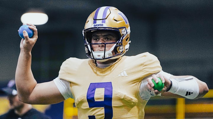 Freshman quarterback Dash Beierly goes through grip- strengthening exercises during spring football. Freshman quarterback Dash Beierly goes through grip- strengthening exercises during spring football.