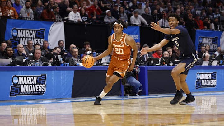 Mar 19, 2025; Dayton, OH, USA; Texas Longhorns guard Tre Johnson (20) dribbles pressured by Xavier Musketeers guard Dailyn Swain (3) in the first half at UD Arena. Mandatory Credit: Rick Osentoski-Imagn Images