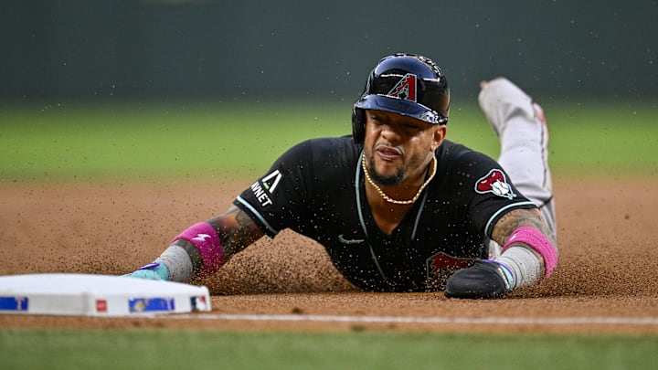 May 13, 2026; Arlington, Texas, USA;  Arizona Diamondbacks second baseman Ketel Marte (4) slides into third base during the third inning against the Texas Rangers at Globe Life Field. Mandatory Credit: Jerome Miron-Imagn Images