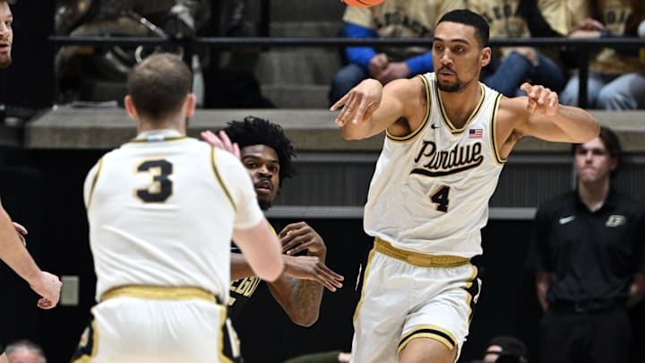 Purdue Boilermakers forward Trey Kaufman-Renn (4) passes the ball to guard Braden Smith (3) 