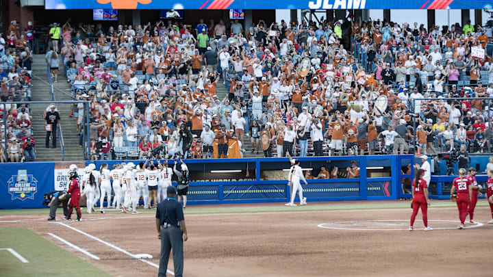 Jun 6, 2025; Oklahoma City, OK, USA;  Texas Longhorns fans cheer after Texas Longhorns utility Mia Scott grand slam in the fourth inning against the Texas Tech Red Raiders during game three of the NCAA Softball Women's College World Series finals at Devon Park. Mandatory Credit: Brett Rojo-Imagn Images
