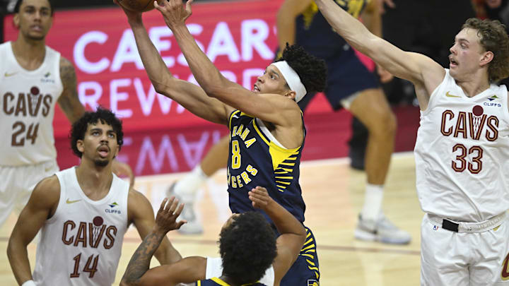 Oct 10, 2024; Cleveland, Ohio, USA; Indiana Pacers forward Enrique Freeman (8) drives to the basket beside Cleveland Cavaliers forward Jaylon Tyson (24), guard Jules Bernard (14), and guard Luke Travers (33) in the fourth quarter at Rocket Mortgage FieldHouse. Mandatory Credit: David Richard-Imagn Images