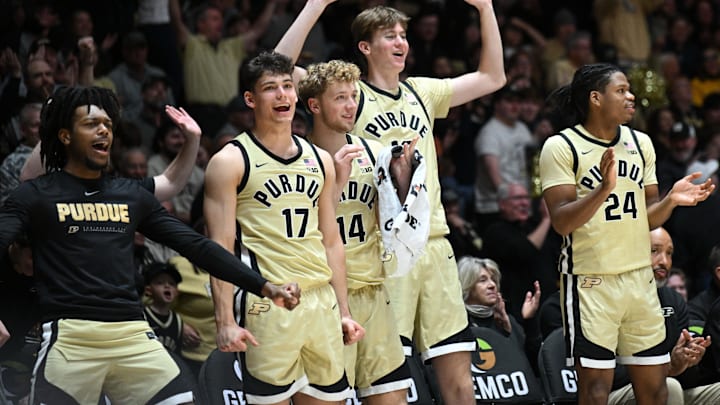 The Purdue Boilermakers bench celebrates a basket.