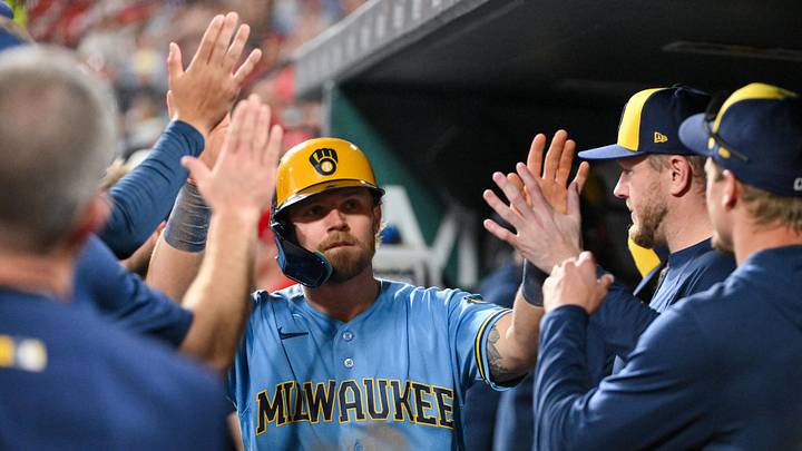 May 4, 2026; St. Louis, Missouri, USA; Milwaukee Brewers first baseman Jake Bauers (9) is congratulated by teammates after scoring against the St. Louis Cardinals during the sixth inning at Busch Stadium. Mandatory Credit: Jeff Curry-Imagn Images