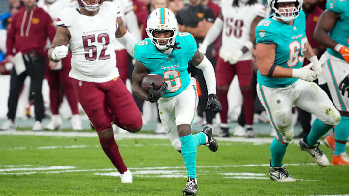 Miami Dolphins wide receiver Malik Washington (6) carries the ball after a reception against the Washington Commanders in the third quarter during the 2025 NFL Madrid Game at Santiago Bernabeu Stadium. 