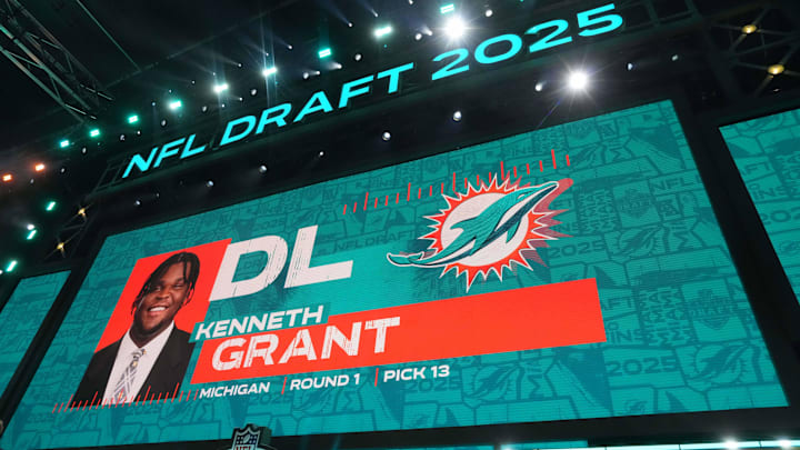 Michigan Wolverines defensive lineman Kenneth Grant is selected as the No. 13 pick by the Miami Dolphins during the 2025 NFL Draft at Lambeau Field. Michigan Wolverines defensive lineman Kenneth Grant is selected as the No. 13 pick by the Miami Dolphins during the 2025 NFL Draft at Lambeau Field.