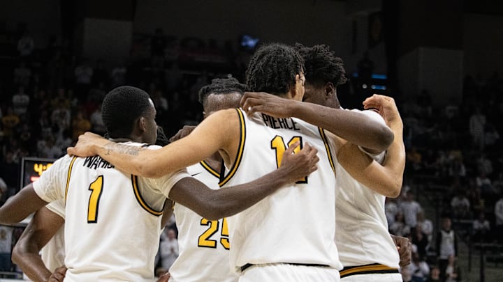 Dec. 3 2024; Columbia, Missouri, USA; Missouri Tigers center Peyton Marshall (right) in a huddle with teammates during a game against the California Golden Bears at Mizzou Arena.