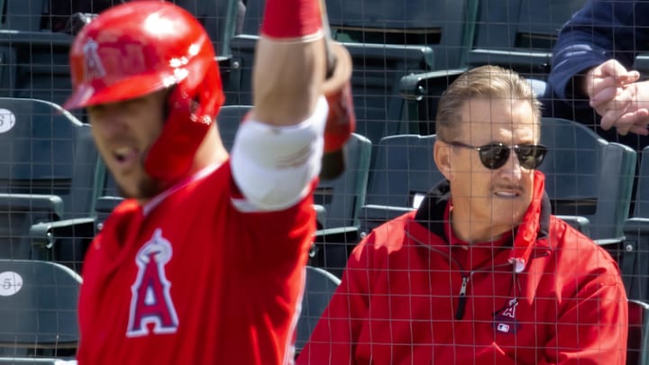 Mar 16, 2021; Tempe, Arizona, USA; Los Angeles Angels owner Arte Moreno (right) and outfielder Mike Trout against the Cleveland Indians during a Spring Training game at Tempe Diablo Stadium. Mandatory Credit: Mark J. Rebilas-Imagn Images