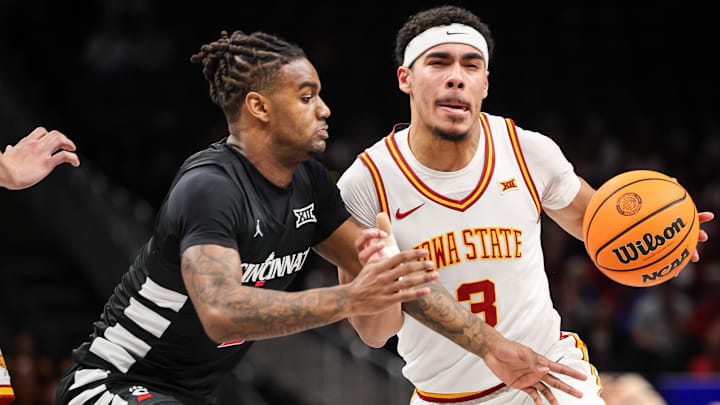 Mar 12, 2025; Kansas City, MO, USA; Iowa State Cyclones guard Tamin Lipsey (3) drives to the basket around Cincinnati Bearcats guard Jizzle James (2) during the first half at T-Mobile Center.