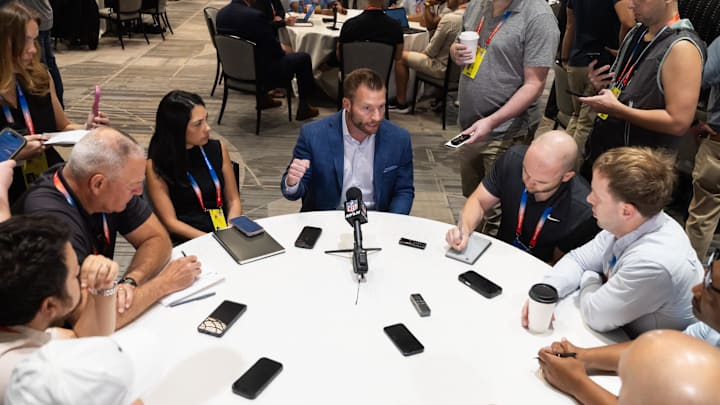 Mar 30, 2026; Phoenix, AZ, USA; Los Angeles Rams head coach Sean McVay (center) speaks to reporters and the media during the 2026 NFL Annual League Meeting at the Arizona Biltmore. Mandatory Credit: Mark J. Rebilas-Imagn Images