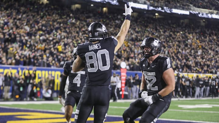 Oct 25, 2025; Morgantown, West Virginia, USA; West Virginia Mountaineers tight end Grayson Barnes (80) celebrates with teammates after catching a pass for a touchdown during the second quarter against the Texas Christian University Horned Frogs at Milan Puskar Stadium. Mandatory Credit: Ben Queen-Imagn Images