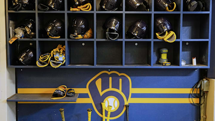 Apr 5, 2025; Milwaukee, Wisconsin, USA;  General view of Milwaukee Brewers batting helmets in the dugout prior to the game against the Cincinnati Reds at American Family Field. Mandatory Credit: Jeff Hanisch-Imagn Images