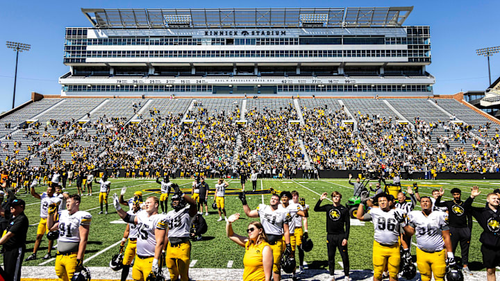 Apr 26, 2025; Iowa City, IA, USA; Iowa Hawkeyes players wave to patients in the Stead Family Children’s Hospital during a spring NCAA football open practice at Kinnick Stadium. Mandatory Credit: Joseph Cress-The Des Moines Register