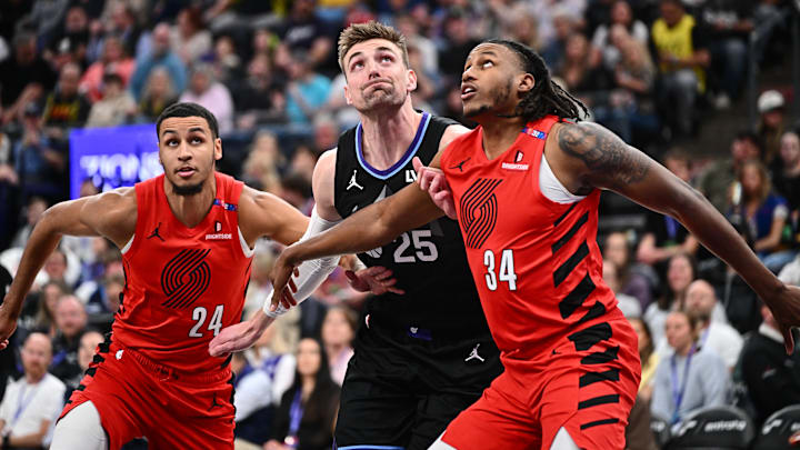 Apr 9, 2025; Salt Lake City, Utah, USA: Utah Jazz center Micah Potter (25) is boxed out beneath the basket by Portland Trail Blazers forward Kris Murray (24) and forward Jabari Walker (34) in the first half at Delta Center. Mandatory Credit: Jamie Sabau-Imagn Images Apr 9, 2025; Salt Lake City, Utah, USA: Utah Jazz center Micah Potter (25) is boxed out beneath the basket by Portland Trail Blazers forward Kris Murray (24) and forward Jabari Walker (34) in the first half at Delta Center. Mandatory Credit: Jamie Sabau-Imagn Images