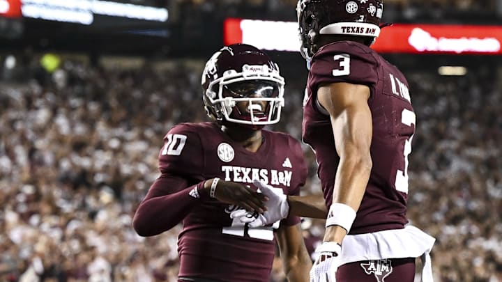 Nov 16, 2024; College Station, Texas, USA; Texas A&M Aggies defensive back Dezz Ricks (10) congratulates wide receiver Noah Thomas (3) after scoring a touchdown during the first quarter against the New Mexico State Aggies at Kyle Field. Mandatory Credit: Maria Lysaker-Imagn Images 
