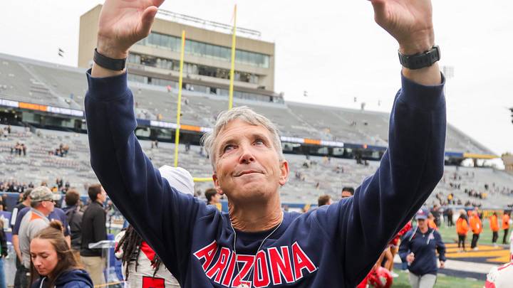 Oct 10, 2026; Morgantown, West Virginia, USA; Arizona Wildcats head coach Brent Brennan celebrates with fans after defeating the West Virginia Mountaineers at Milan Puskar Stadium. Oct 10, 2026; Morgantown, West Virginia, USA; Arizona Wildcats head coach Brent Brennan celebrates with fans after defeating the West Virginia Mountaineers at Milan Puskar Stadium.