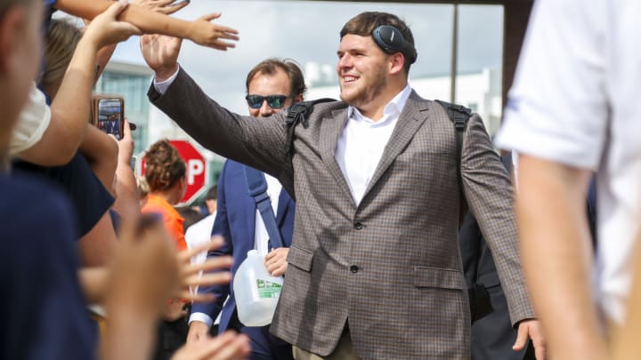 Sep 9, 2023; Morgantown, West Virginia, USA; West Virginia Mountaineers offensive lineman Zach Frazier (54) participates in the Mantrip as players arrive before their game against the Duquesne Dukes at Mountaineer Field at Milan Puskar Stadium. Mandatory Credit: Ben Queen-USA TODAY Sports Sep 9, 2023; Morgantown, West Virginia, USA; West Virginia Mountaineers offensive lineman Zach Frazier (54) participates in the Mantrip as players arrive before their game against the Duquesne Dukes at Mountaineer Field at Milan Puskar Stadium. Mandatory Credit: Ben Queen-USA TODAY Sports