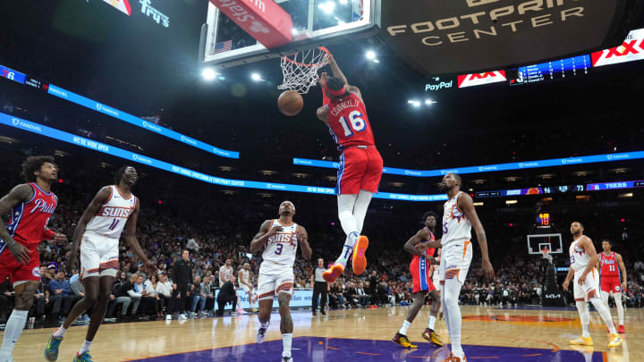 Mar 20, 2024; Phoenix, Arizona, USA; Philadelphia 76ers guard Ricky Council IV (16) dunks against