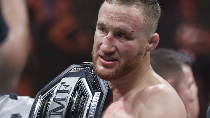 Jul 29, 2023; Salt Lake City, Utah, USA; Justin Gaethje (blue gloves) reacts to defeating Dustin Poirier (red gloves) during UFC 291 at Delta Center. Mandatory Credit: Jeff Swinger-Imagn Images