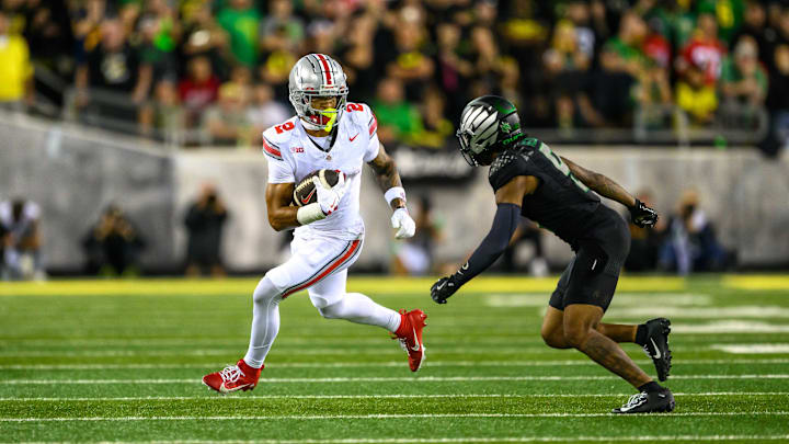 Oct 12, 2024; Eugene, Oregon, USA; Ohio State Buckeyes wide receiver Emeka Egbuka (2) runs the ball after a catch during the fourth quarter against the Oregon Ducks at Autzen Stadium. Mandatory Credit: Craig Strobeck-Imagn Images