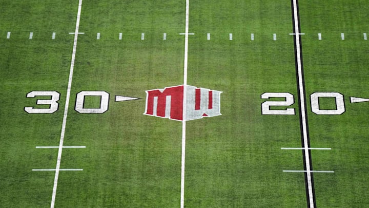 The Mountain West conference logo on the field at Allegiant Stadium. Mandatory Credit: Kirby Lee-Imagn Images