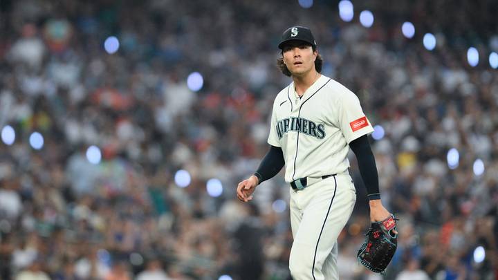 Aug 5, 2026; Seattle, Washington, USA; Seattle Mariners starting pitcher Bryan Woo (22) walks off the field after the final out of the seventh inning against the Detroit Tigers at T-Mobile Park. Mandatory Credit: Steven Bisig-Imagn Images