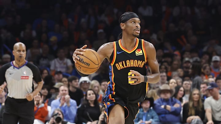 Dec 29, 2024; Oklahoma City, Oklahoma, USA; Oklahoma City Thunder guard Shai Gilgeous-Alexander (2) dribbles the ball down the court against the Memphis Grizzlies during the second quarter at Paycom Center. Mandatory Credit: Alonzo Adams-Imagn Images Dec 29, 2024; Oklahoma City, Oklahoma, USA; Oklahoma City Thunder guard Shai Gilgeous-Alexander (2) dribbles the ball down the court against the Memphis Grizzlies during the second quarter at Paycom Center. Mandatory Credit: Alonzo Adams-Imagn Images
