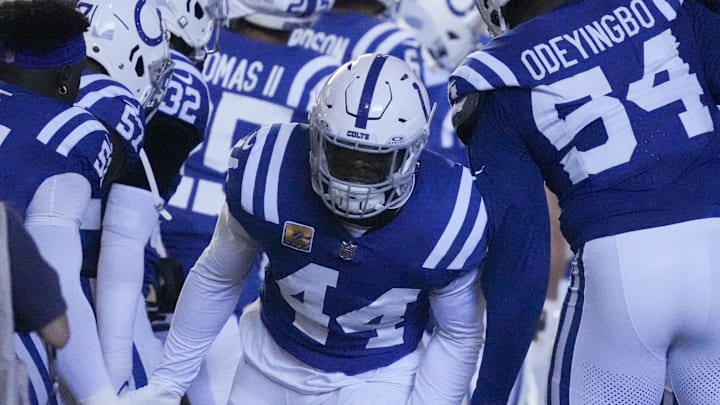 Oct 20, 2024; Indianapolis, Indiana, USA;  Indianapolis Colts linebacker Zaire Franklin (44) high fives his teammates as he takes the field during a game against the Miami Dolphins at Lucas Oil Stadium. Mandatory Credit: Christine Tannous/IndyStar USA TODAY Network via Imagn Images