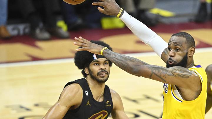 Dec 6, 2022; Cleveland, Ohio, USA; Los Angeles Lakers forward LeBron James (6) throws a no-look pass beside Cleveland Cavaliers center Jarrett Allen (31) in the third quarter at Rocket Mortgage FieldHouse. Mandatory Credit: David Richard-Imagn Images