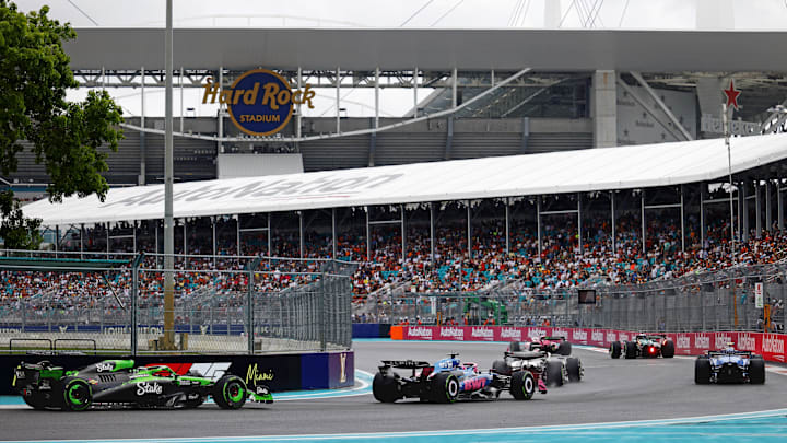 The field goes through turn 17 during the pace laps before the F1 Miami Grand Prix Sprint Race at Miami International Autodrome. 