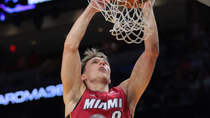 Mar 14, 2025; Miami, Florida, USA; Miami Heat guard Pelle Larsson (9) dunks against Boston Celtics center Al Horford (42) during the second quarter at Kaseya Center. Mandatory Credit: Sam Navarro-Imagn Images Mar 14, 2025; Miami, Florida, USA; Miami Heat guard Pelle Larsson (9) dunks against Boston Celtics center Al Horford (42) during the second quarter at Kaseya Center. Mandatory Credit: Sam Navarro-Imagn Images