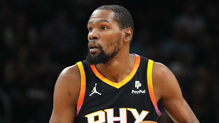 Apr 3, 2024; Phoenix, Arizona, USA; Phoenix Suns forward Kevin Durant (35) controls the ball against
