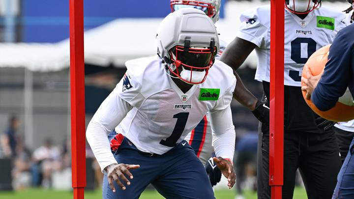 Jul 28, 2026; Foxborough, MA, USA; New England Patriots wide receiver A.J. Brown (1) works with a member of the coaching staff during training camp at Gillette Stadium. Mandatory Credit: Eric Canha-Imagn Images